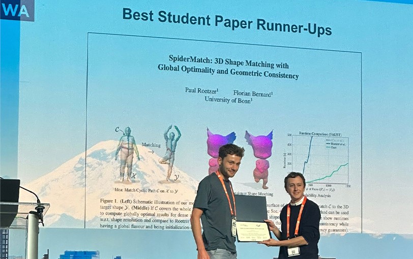 Paul Rötzer receives the certificate for the ‘Best Student Paper Runner-Ups’ award at CVPR 2024.