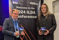 Dr. Matthias Frank (Institute for Computer Science 4, University of Bonn) and Dirk Apitz (DexLogic Karlsruhe) receive the Special Achievements Award at the ILDA Conference 2024