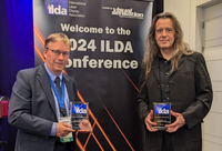 Dr. Matthias Frank (Institute for Computer Science 4, University of Bonn) and Dirk Apitz (DexLogic Karlsruhe) receive the Special Achievements Award at the ILDA Conference 2024